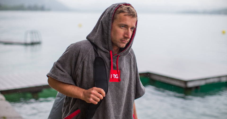 Man wearing Red Original towelling change robe in grey