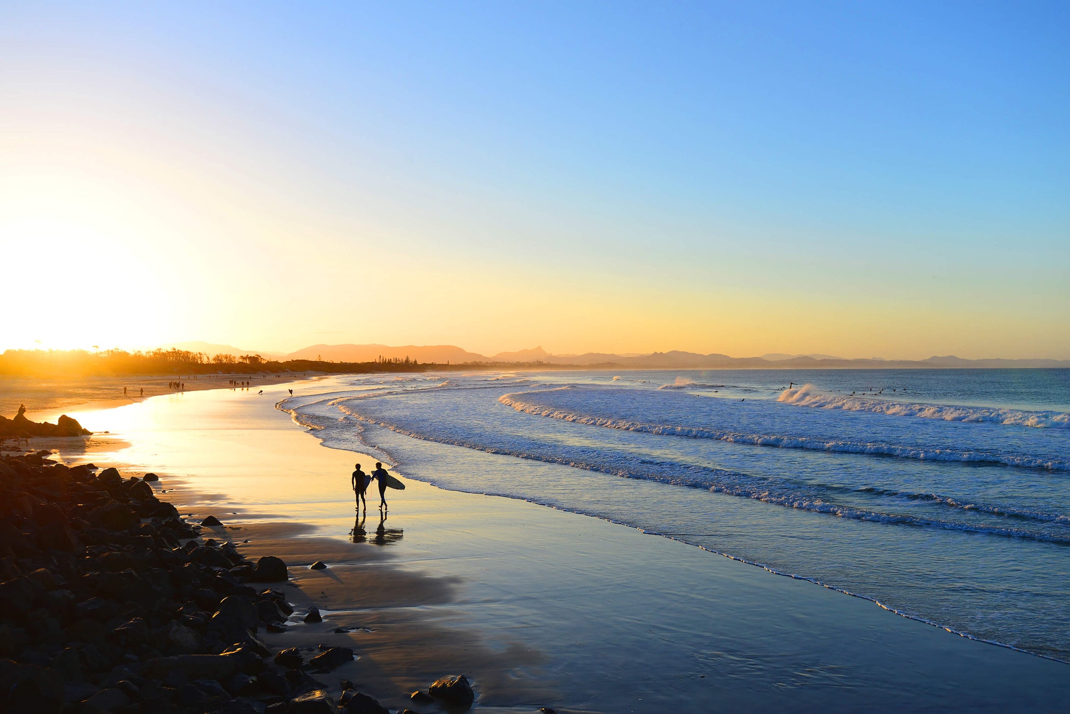 Image of the sun setting on Byron Beach