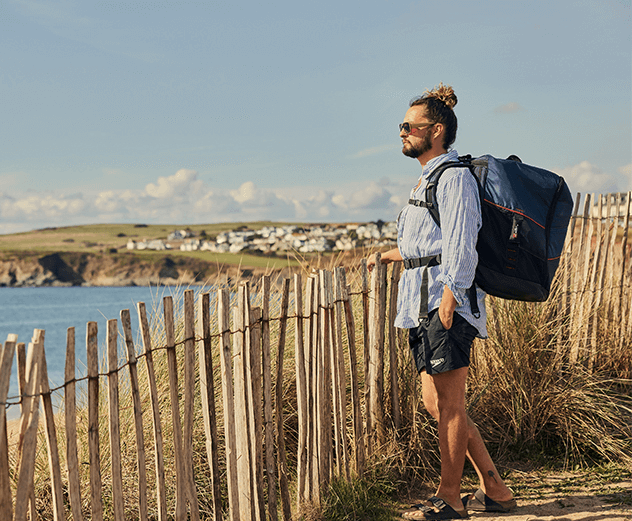 Man carrying Red Original Board Bag