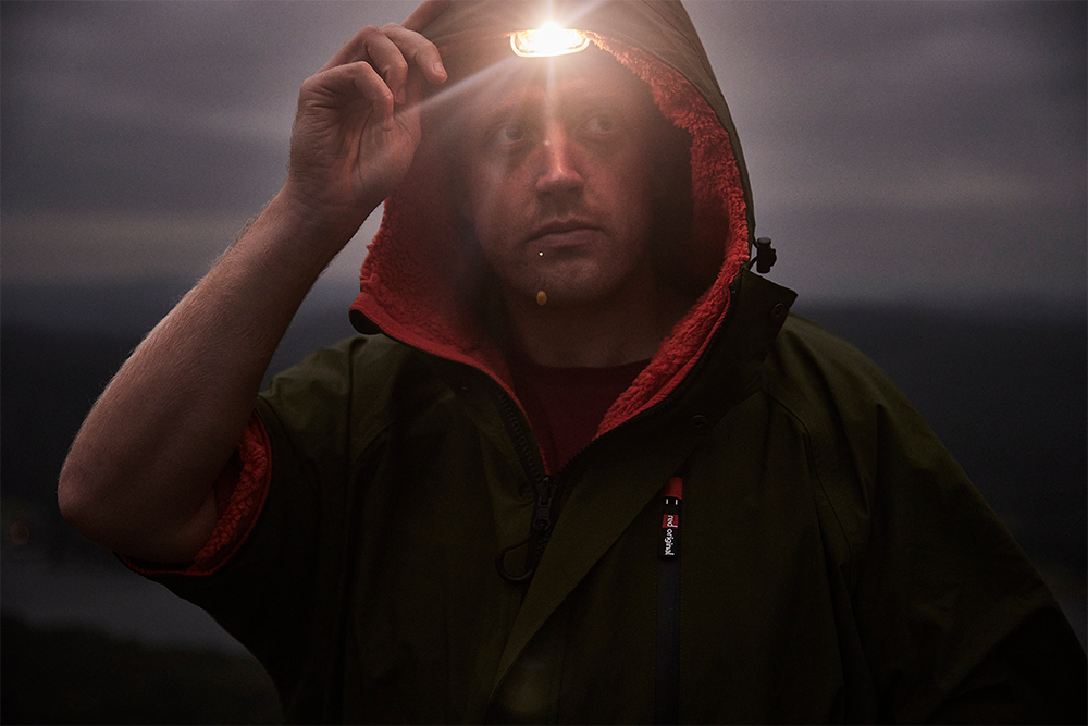 Man wearing head torch in the dark